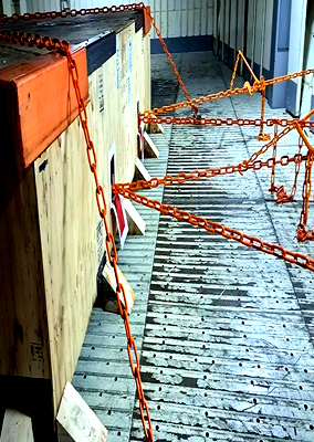 Industrial cargo secured with chains inside a vessel